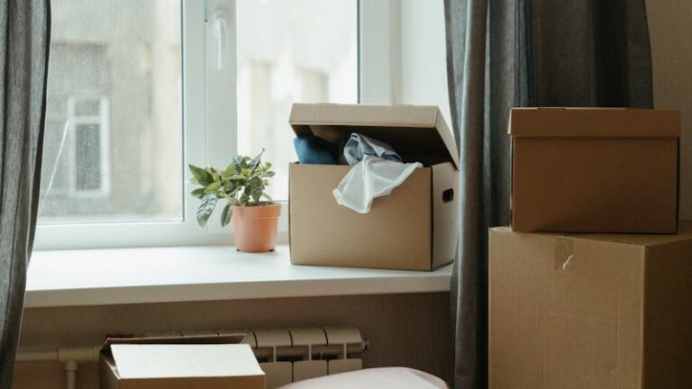 Brown Cardboard Box on White Bed