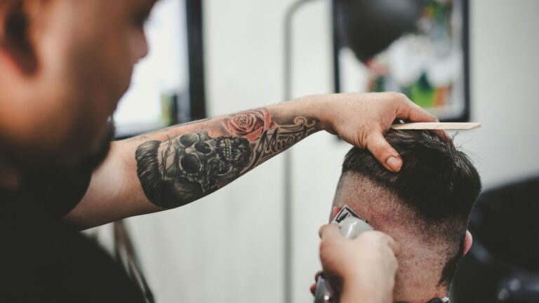 man cutting hair of man